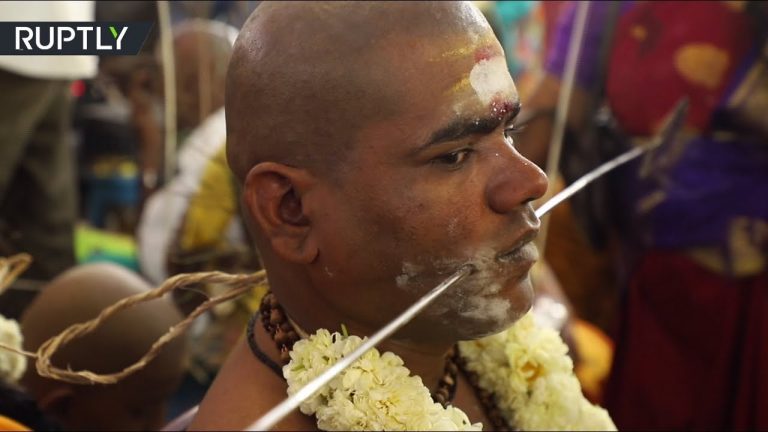 Video: Pilgrims pierce bodies and walk over hot coals celebrating Thaipusam in India (GRAPHIC)