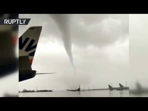 Video: Damaged planes & toppled buses: Tornado wreaks havoc on Turkish airport