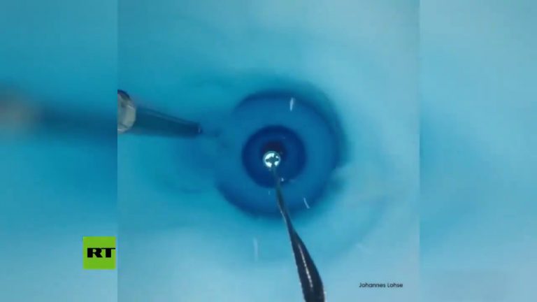 Video: Traveling down a 650m-deep blue hole in an Antarctic ice shelf