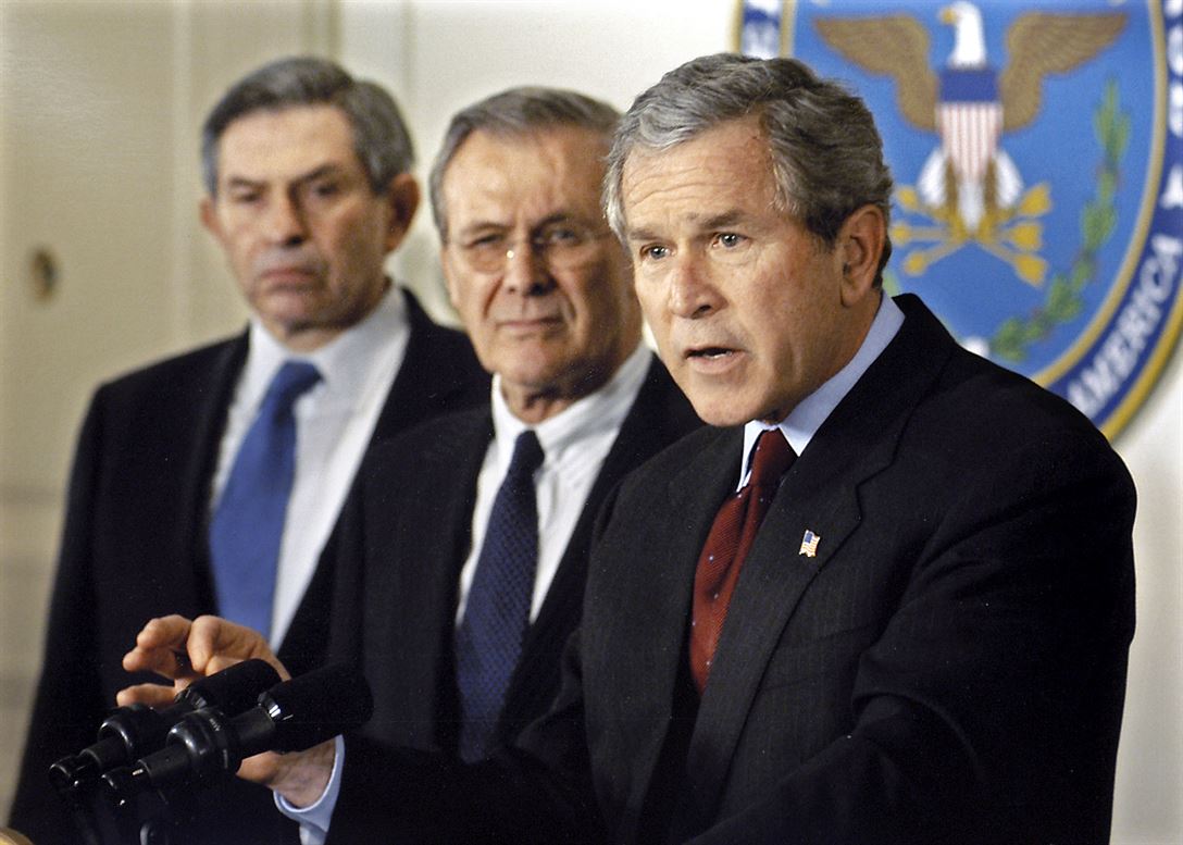 Defense Secretary Donald H. Rumsfeld, middle, Deputy Secretary of Defense Paul Wolfowitz, at left. (Defense Department photographer Robert D. Ward) 